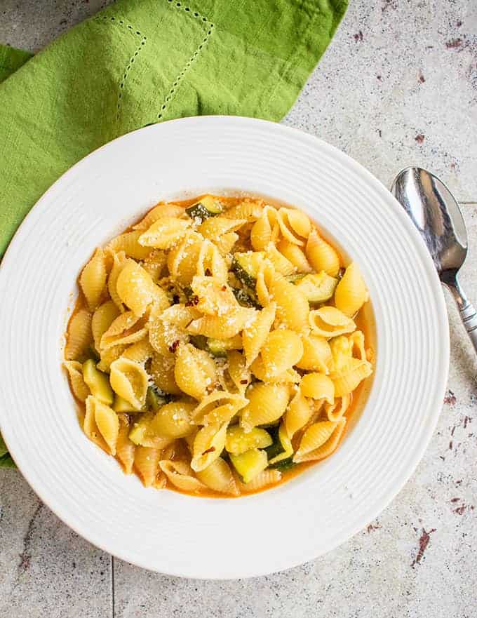 Photo of Pasta with Zucchini in bowl with spoon next to it