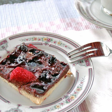 overhead view of slice of Chocolate Strawberry Cookie Bar on a plate with fork