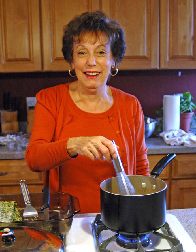 woman stirring something in a pot