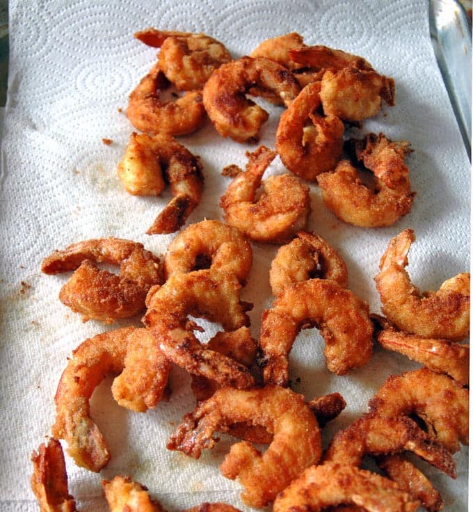 Fried Shrimp on a paper towel on a sheet tray