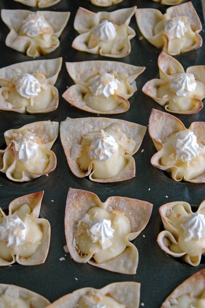 coconut cream pie cups on a sheet tray