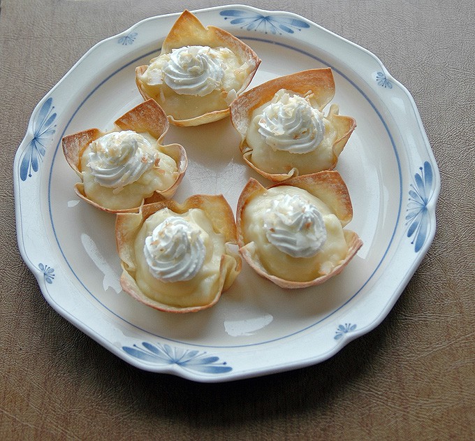 overhead view of plate of coconut cream pie cups