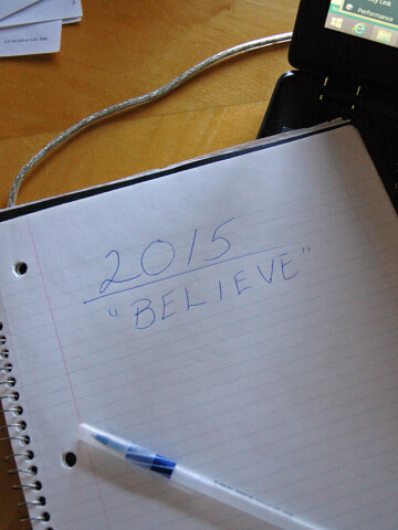 notebook with "2015 BELIEVE" written in pen
