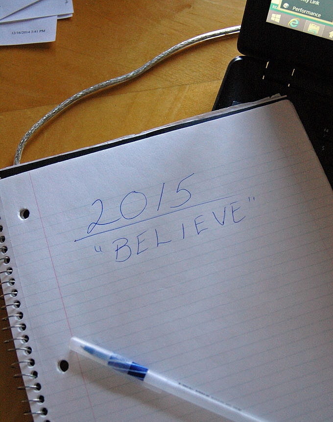 \"2015 BELIEVE\" written in pen on a notebook 