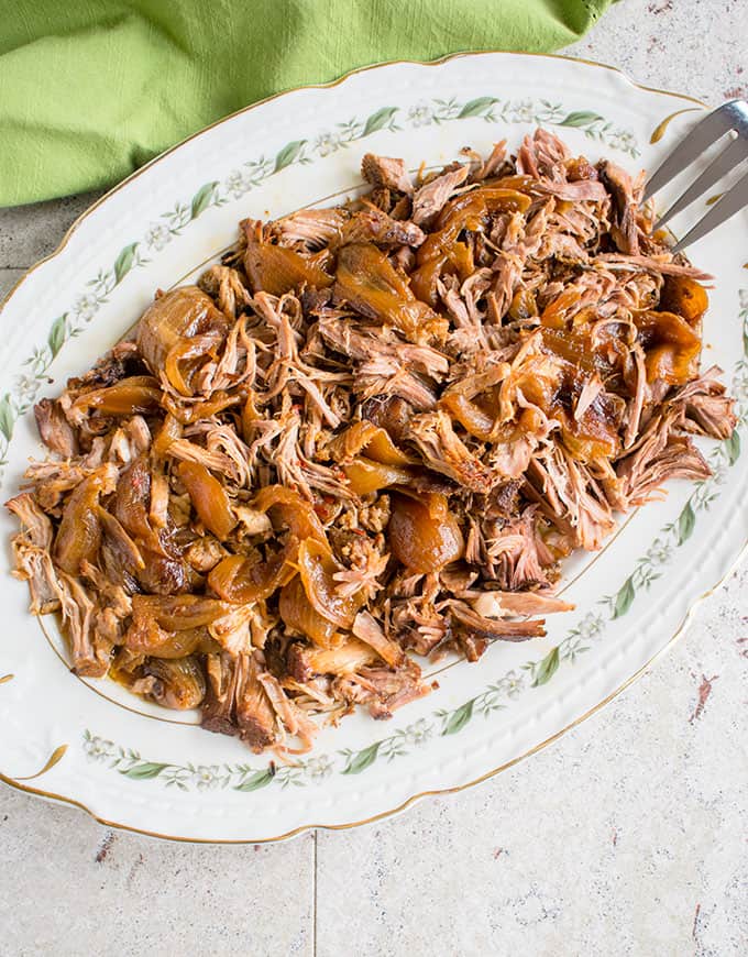 Platter of slow cooker carolina pulled pork with a serving fork