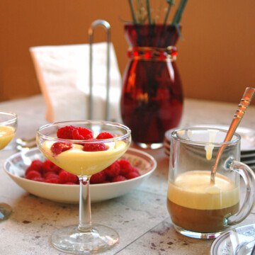 Breakfast Zabaglione with Berries and Espresso in a martini glass, bowl of berries and glass mug of espresso