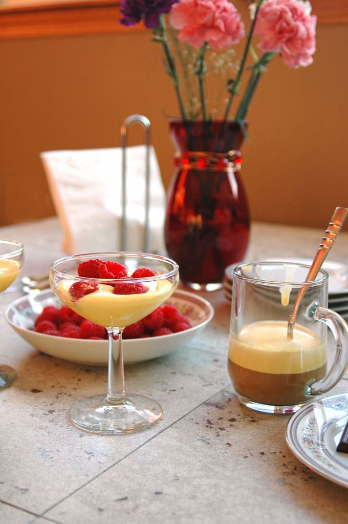 Breakfast Zabaglione with Berries and Espresso in a martini glass, bowl of berries and glass mug of espresso
