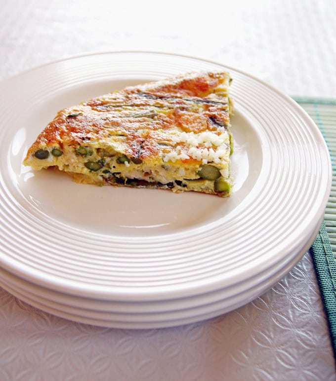 slice of Asparagus Frittata on stacked plates