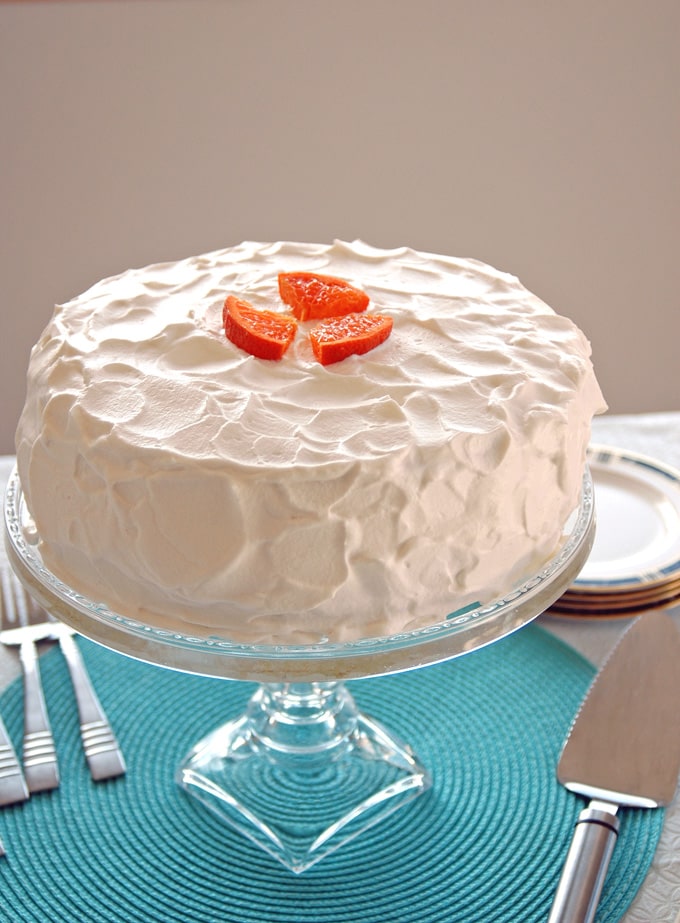 cake stand with Orange Torte with Whipped Cream