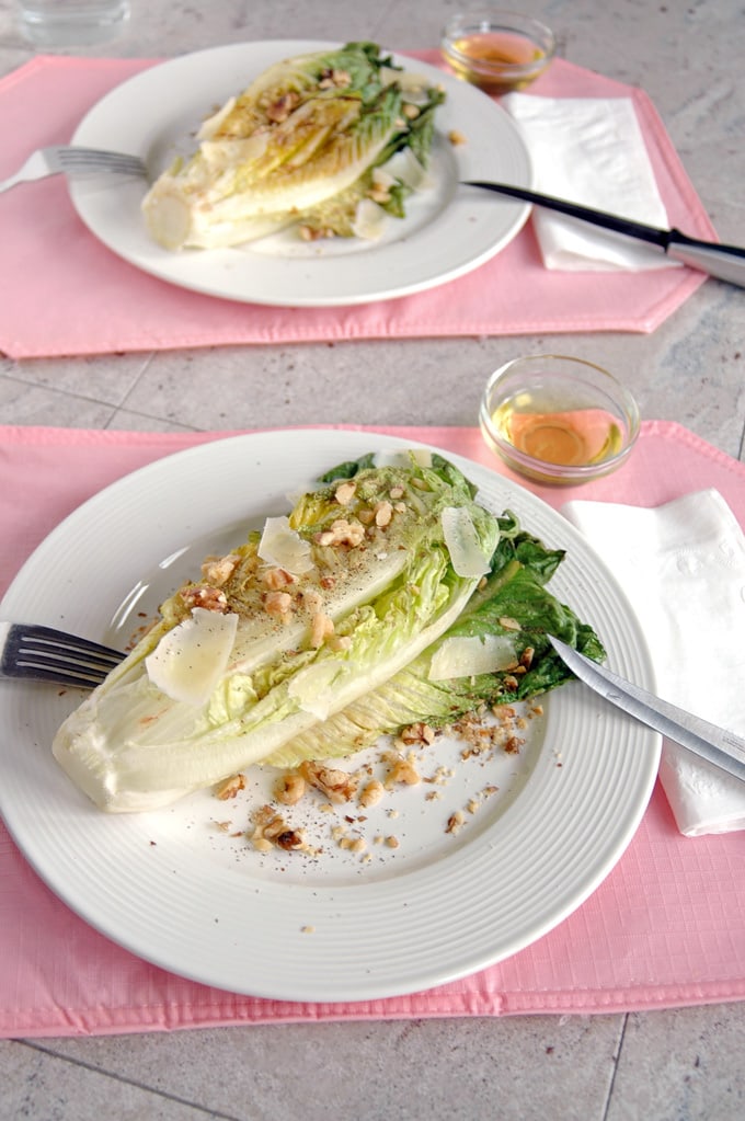 plate of Grilled Romaine with Toasted Walnuts and Parmesan with fork and knife