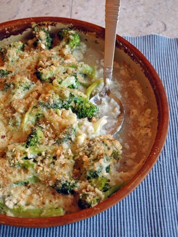 Baking dish of Broccoli and Fontina Gratin and spoon