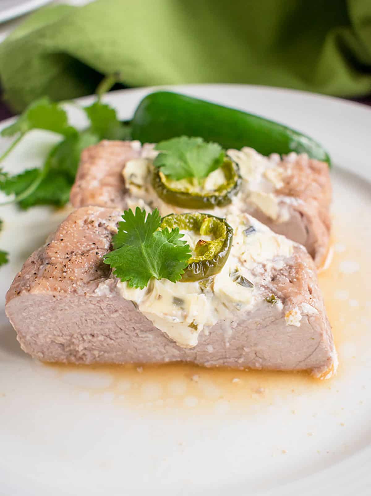photo of sliced stuffed pork tenderloin with cream cheese and jalapenos