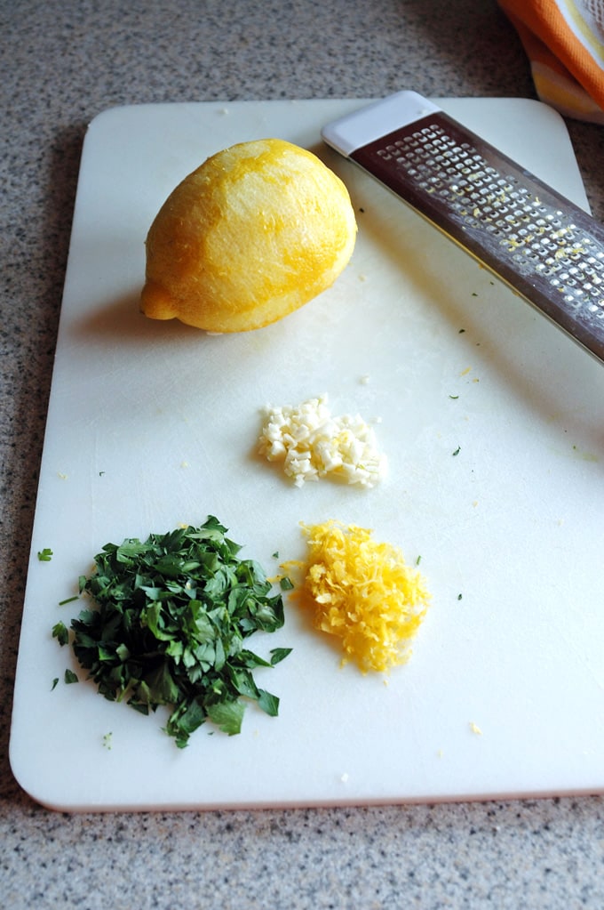 lemon zest, chopped parsley and chopped garlic, lemon zester and zested lemon