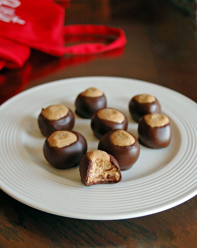 buckeye candies on a plate with one half-eaten