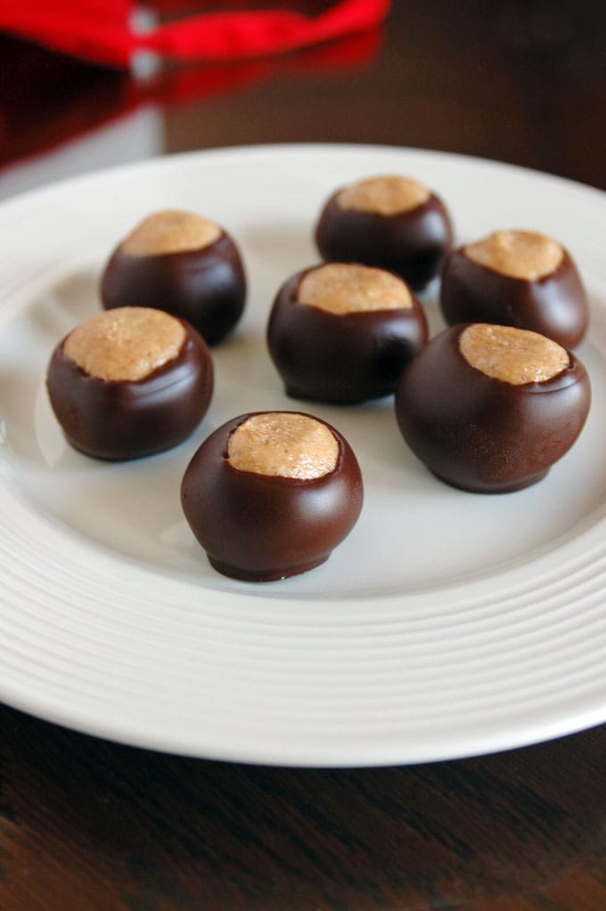 seven buckeye candies on a plate