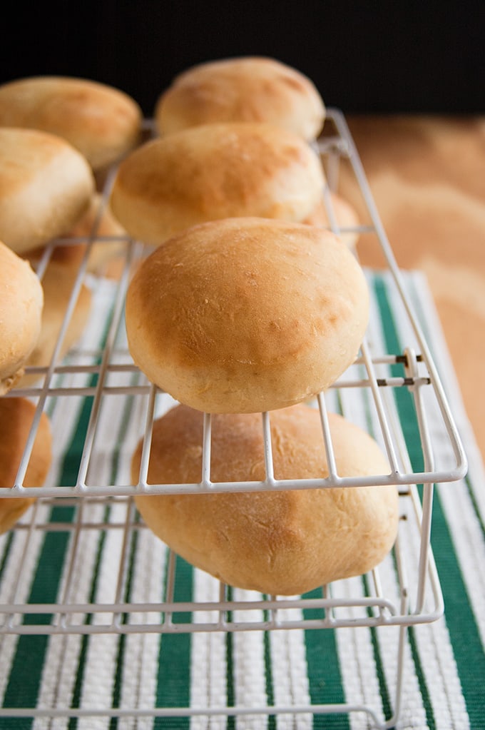 Homemade hamburger buns on a cooling rack