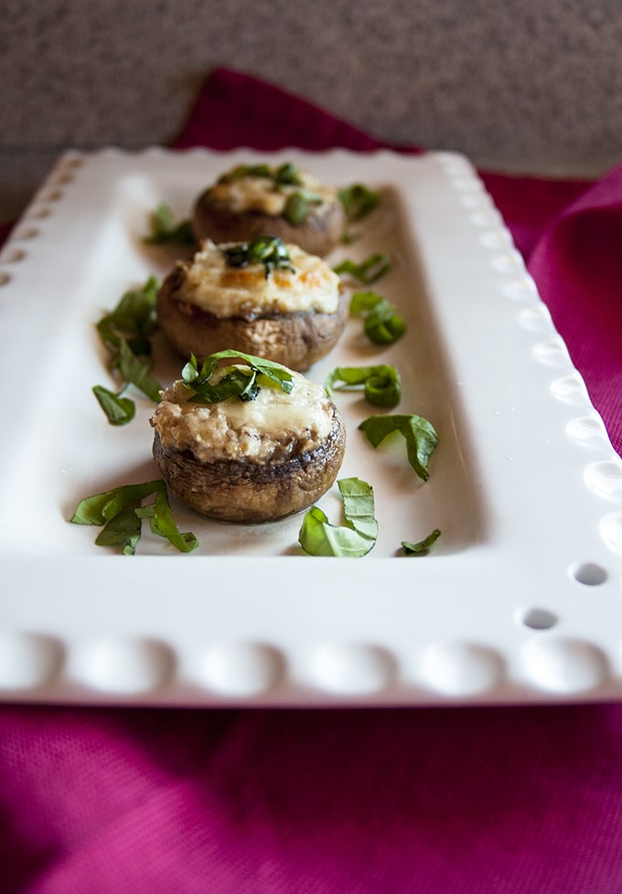 close-up of stuffed mushrooms with cream cheese on a platter