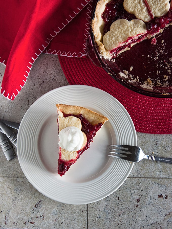 overhead view of a slice of Cranberry Pie on a plate with fork