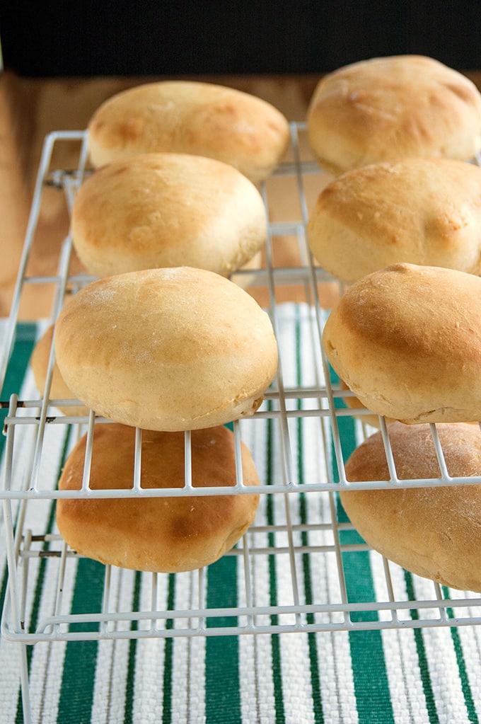 close-up of homemade hamburger buns on drying racks