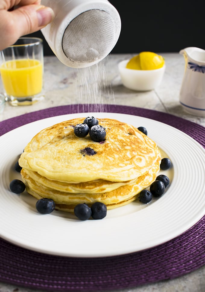 stack of lemon-blueberry pancakes on a plate