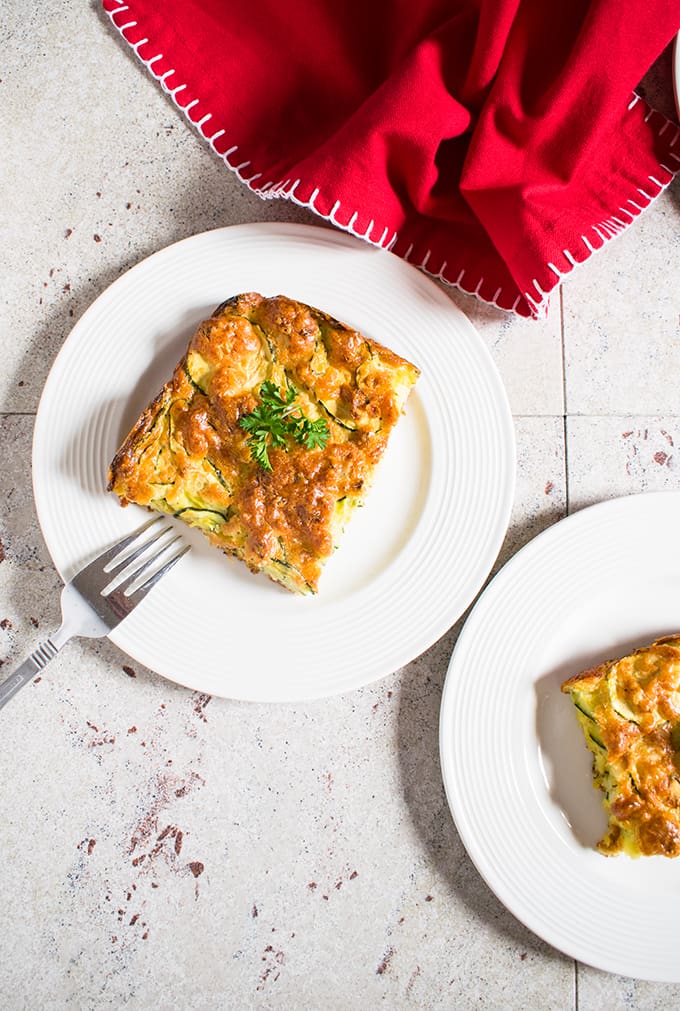 Overhead view of slices of zucchini casserole on plates