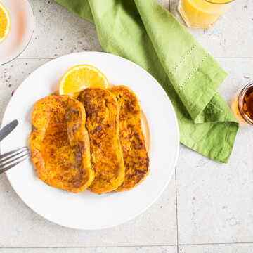 Overhead view of pumpkin-orange french toast on a plate