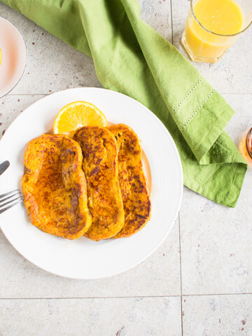 Overhead view of pumpkin-orange french toast on a plate