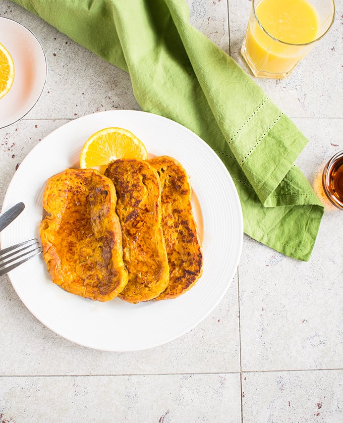 Overhead view of pumpkin-orange french toast on a plate