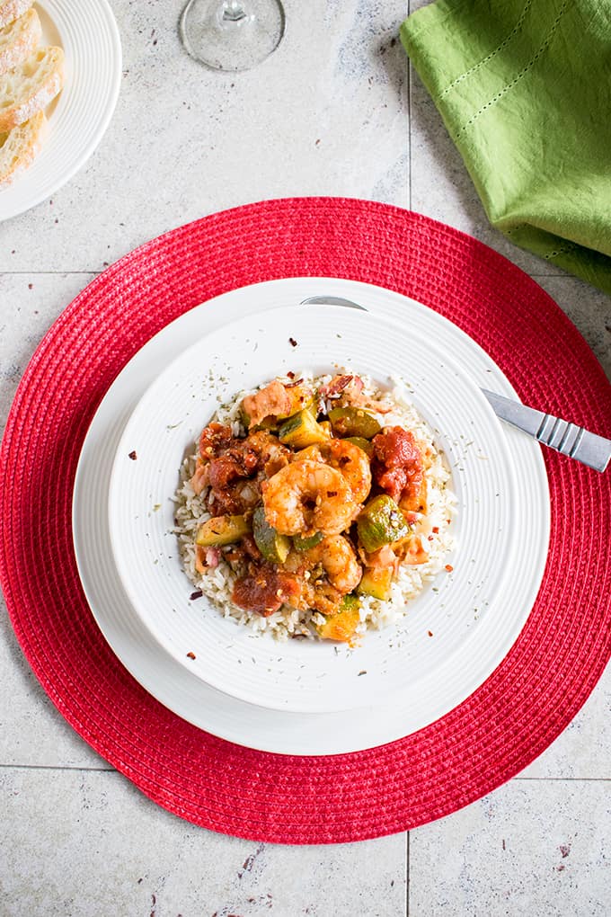 overhead view of shrimp stew with bacon in a bowl