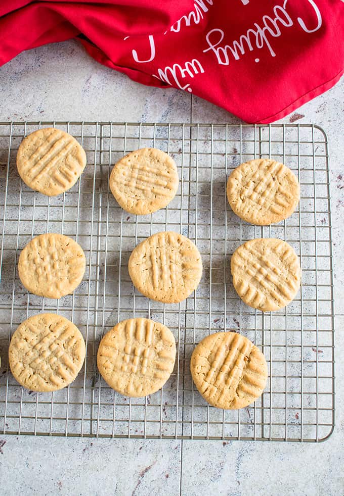 overhead shot of peanut butter cookies on a cooling tray 