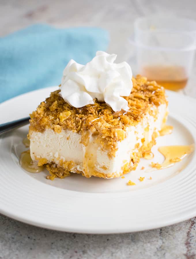 fried ice cream topped with whipped cream on a plate