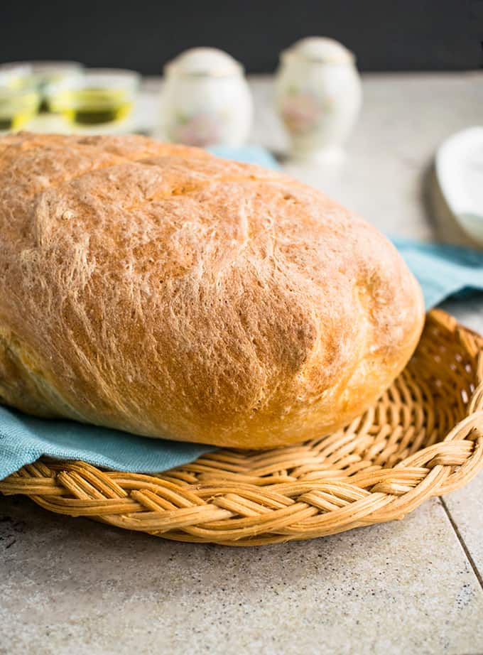 homemade italian bread loaf in a basket