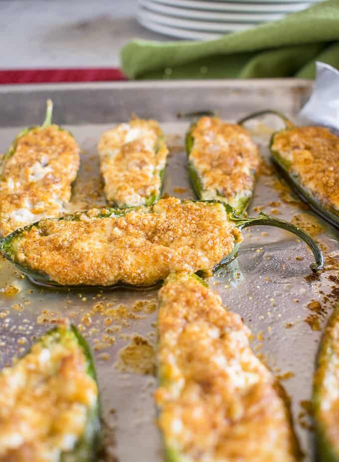 baked jalapeno poppers on a sheet tray 