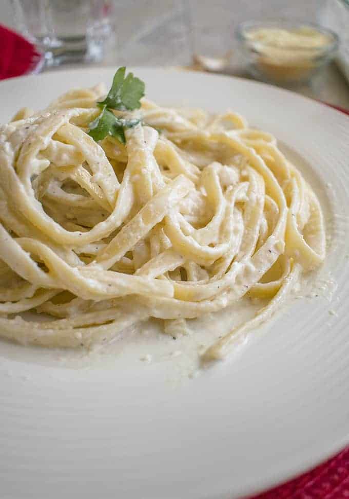 close-up photo of fettuccini with homemade alfredo sauce on a plate