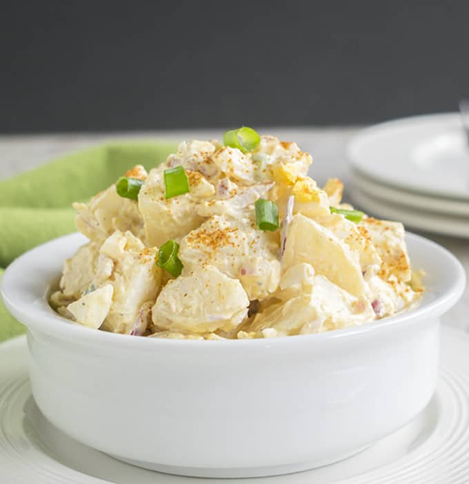 close-up photo of deviled egg potato salad in a bowl 