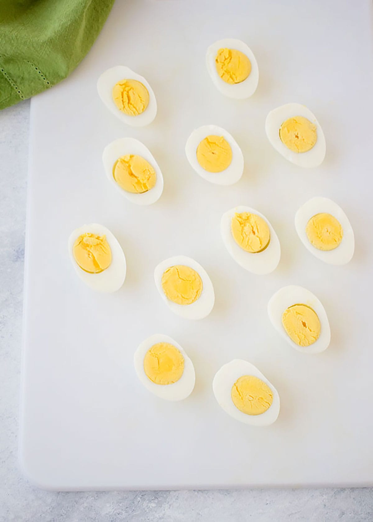 overhead view of hard-boiled eggs cut in half