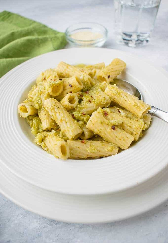 bowl of pasta with broccoli with spoon