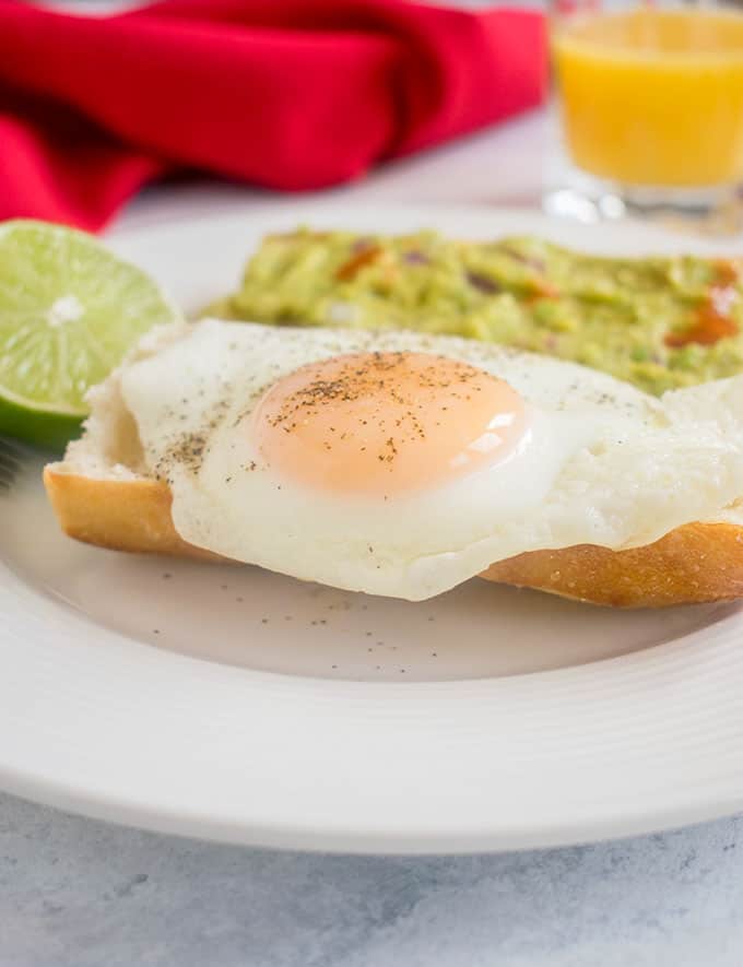 Basted egg on a toasted baguette with guacamole on toast