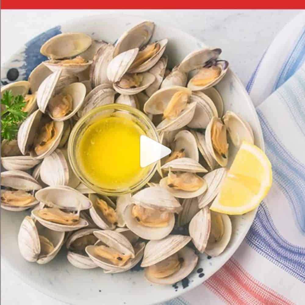 bowl of clams with melted butter, lemon