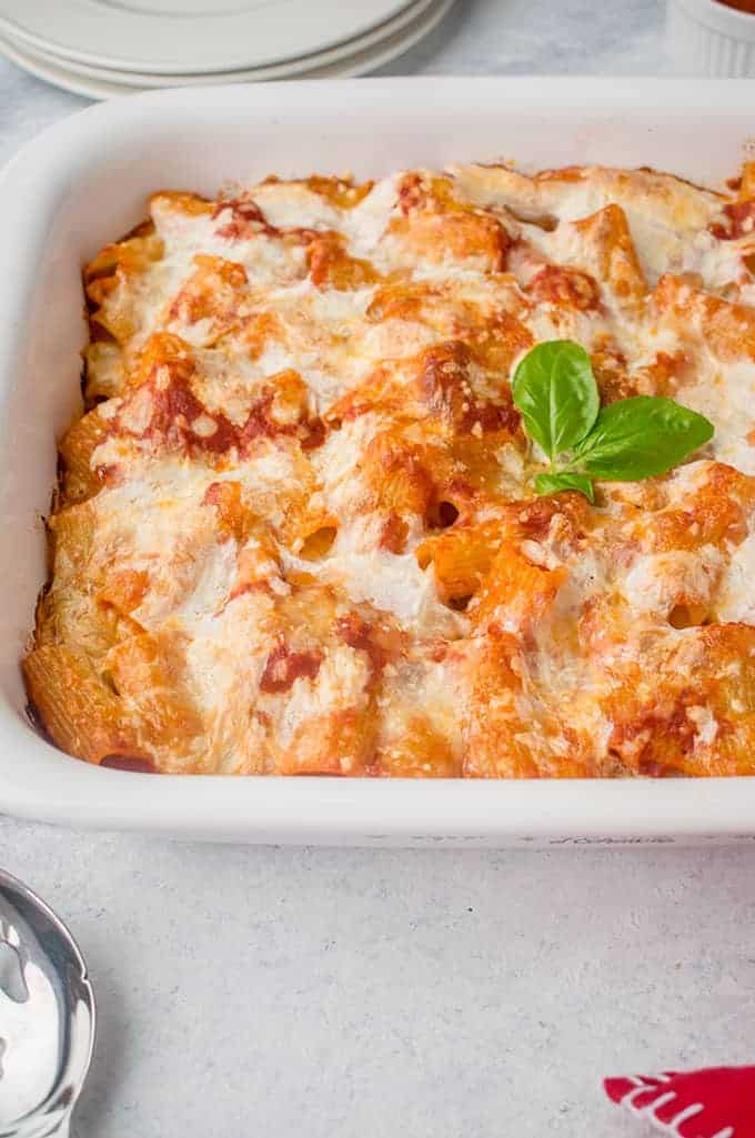 pan of baked pasta with cheese and basil