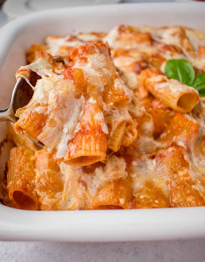 spoonful of baked rigatoni with cheese and marinara