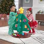 babies playing with toy Christmas tree