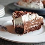 slice of chocolate pudding pie with brownie crust and whipped cream