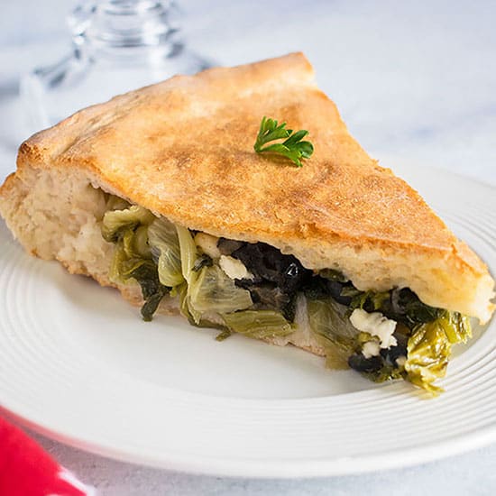 slice of stuffed pizza with escarole