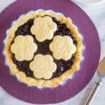 whole blueberry pie with cookies on top
