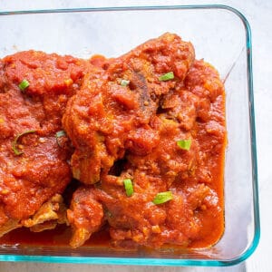 bowl of ribs with tomato sauce