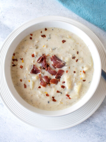 overhead view of soup in bowl with bacon