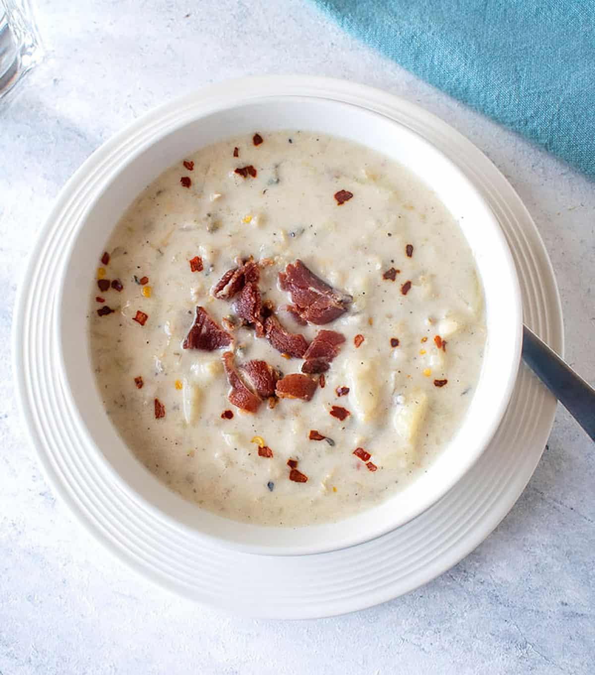 closeup view of bowl of chowder with bacon