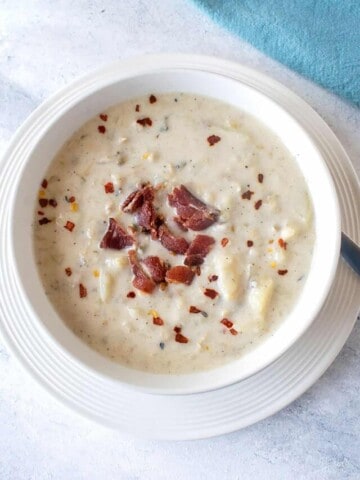 closeup view of bowl of chowder with bacon