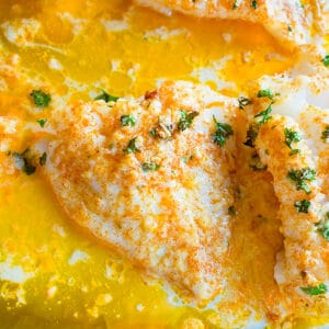 cooked fish in melted butter